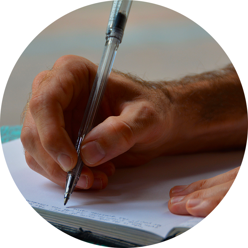 Image of hand writing in a journal